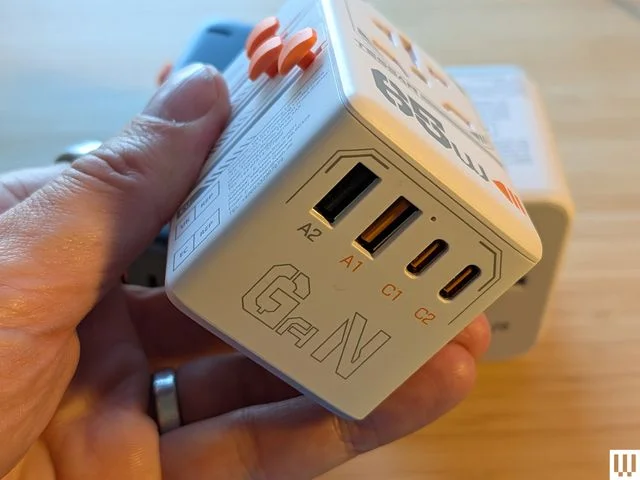 Image may contain Adapter Electronics Baby Person and Hardware