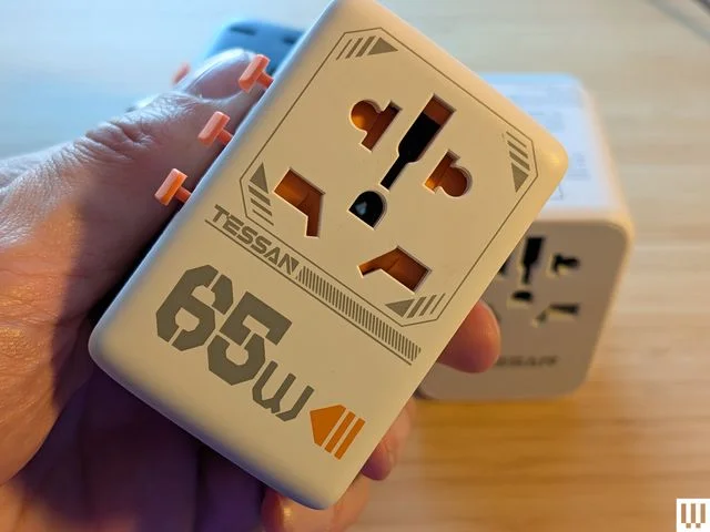 Image may contain Adapter Electronics Electrical Device Electrical Outlet and Mailbox