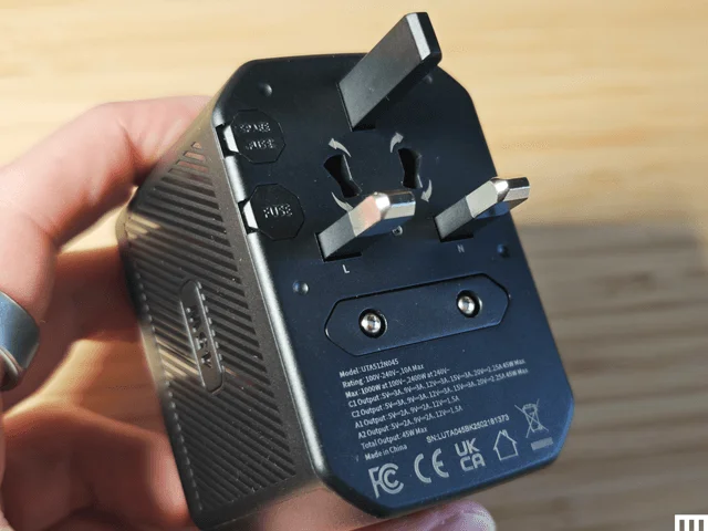 Image may contain Adapter Electronics Body Part Finger Hand Person and Phone