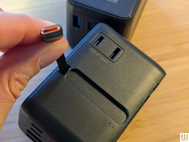 Image may contain Adapter Electronics Mobile Phone and Phone