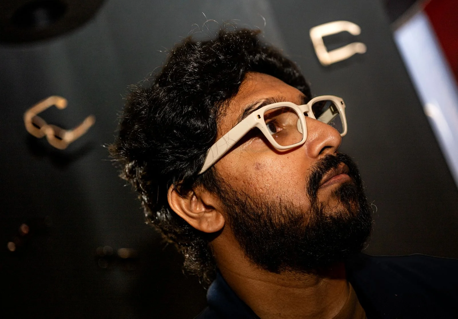 Image may contain Head Person Face Accessories Glasses Sunglasses Adult Black Hair Hair Goggles and Beard
