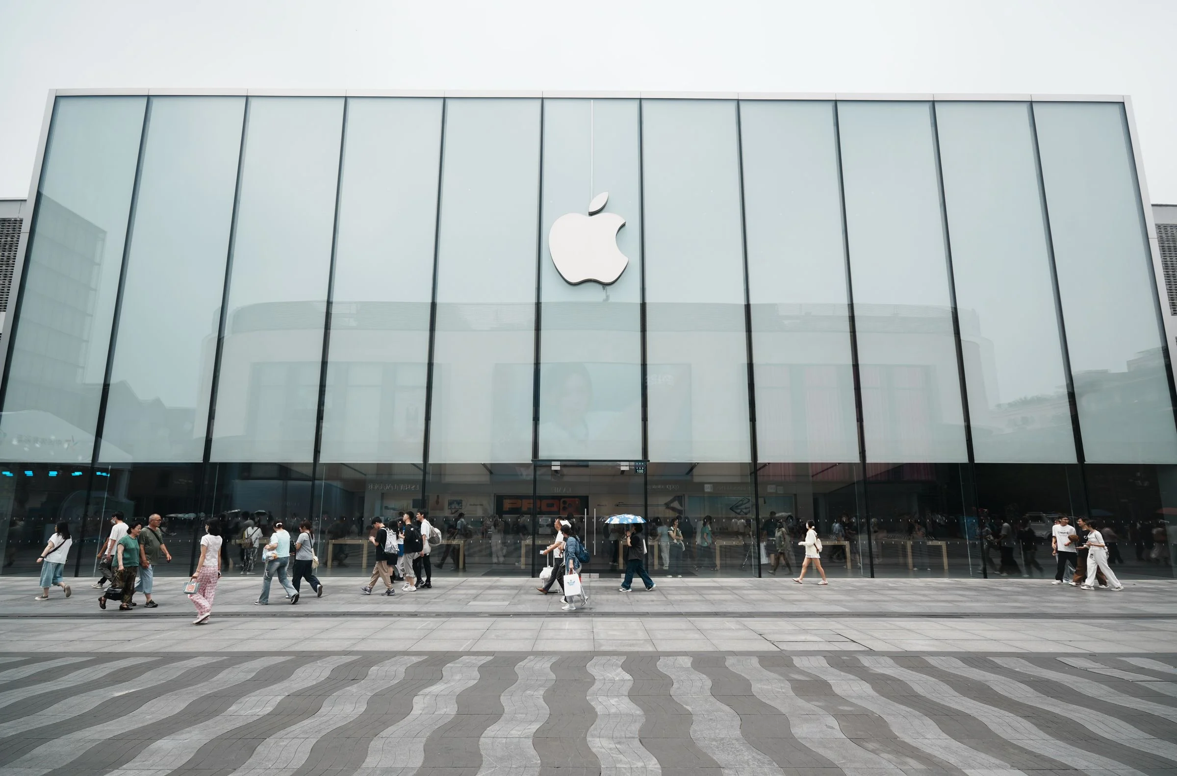 Image may contain Person Walking People Architecture Building Office Building Accessories Bag Handbag and Airport
