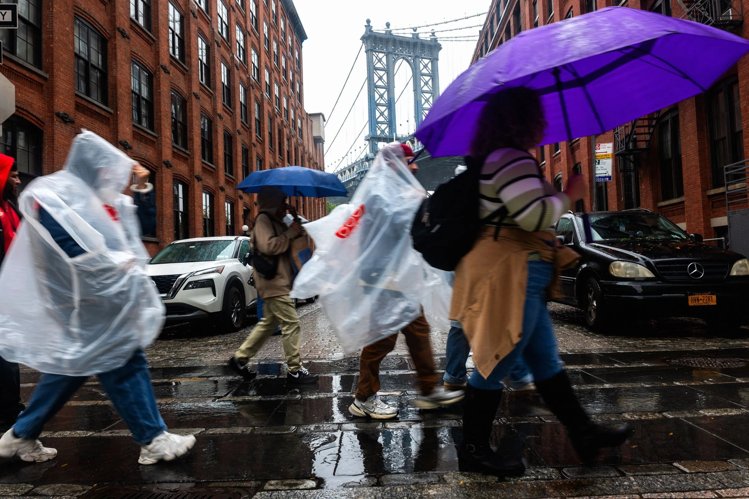 NEW YORK NEW YORK  OCTOBER 13 People walk through Brooklyn in the rain as New York City experiences wind and rain...
