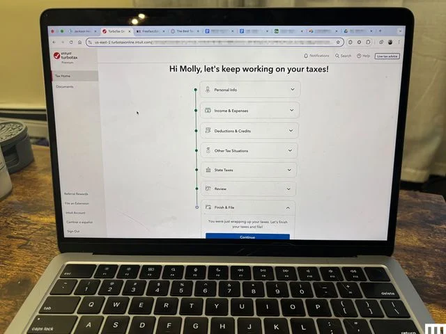 Closeup of an open laptop with the screen showing Turbo Tax tax filing software