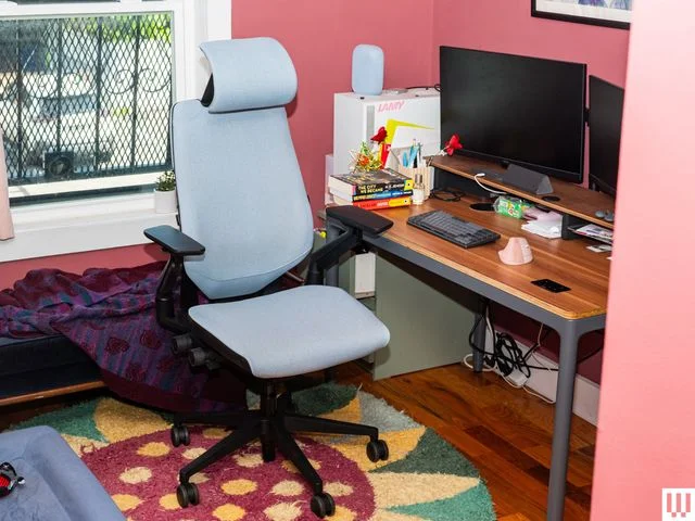 Image may contain: Furniture, Chair, Indoors, Home Decor, Rug, Computer, Computer Hardware, and Computer Keyboard