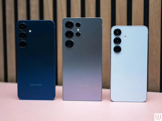 Rear view of three smartphones  showing the camera lenses of each