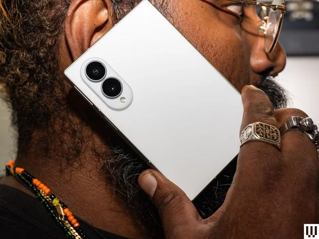 Image may contain Photography Electronics Mobile Phone Phone Adult Person Head and Face