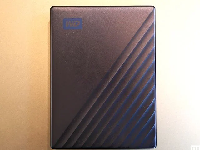 Overhead view of Western Digital My Passport Ultra external hard drive, a slim dark rectangular device
