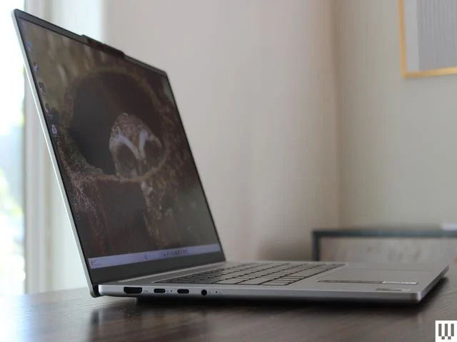 Side view of silver laptop on a desk