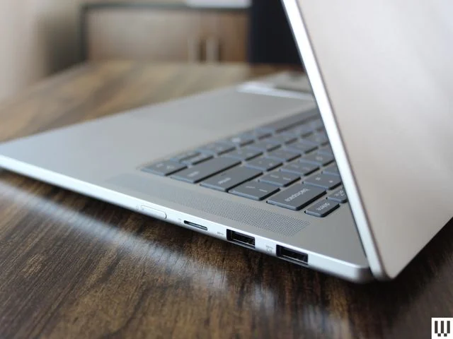 Side view of silver laptop, showing the ports