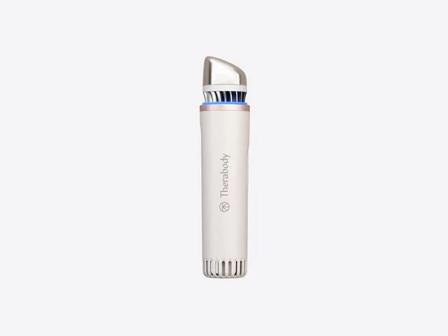 Therabody TheraFace Depuffing Wand, a thick white cylindrical device with a silver top